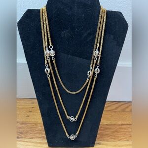 Elegant Long Gold Necklace Features Silver Open Spheres